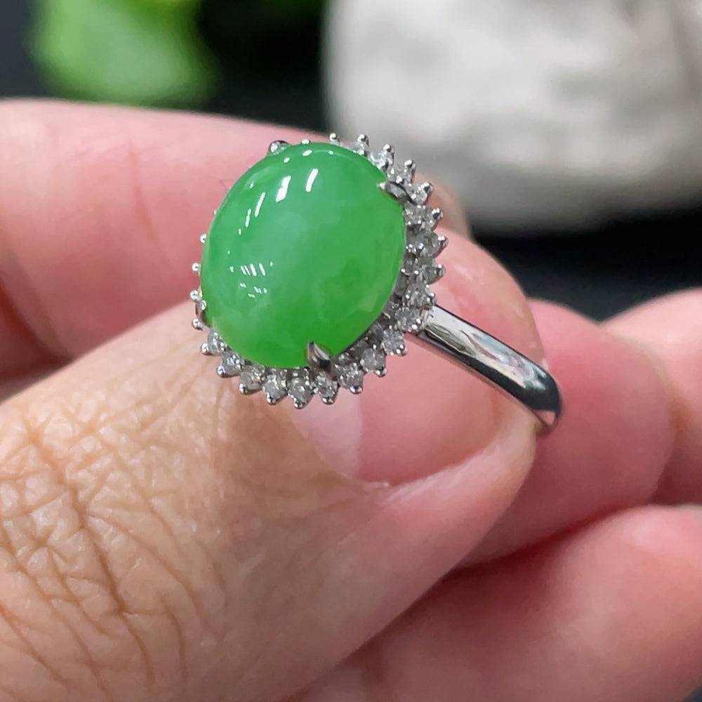 Huiliu Jadeite cabochon ring with diamond accents, featuring a polished green jade stone and elegant gold band.