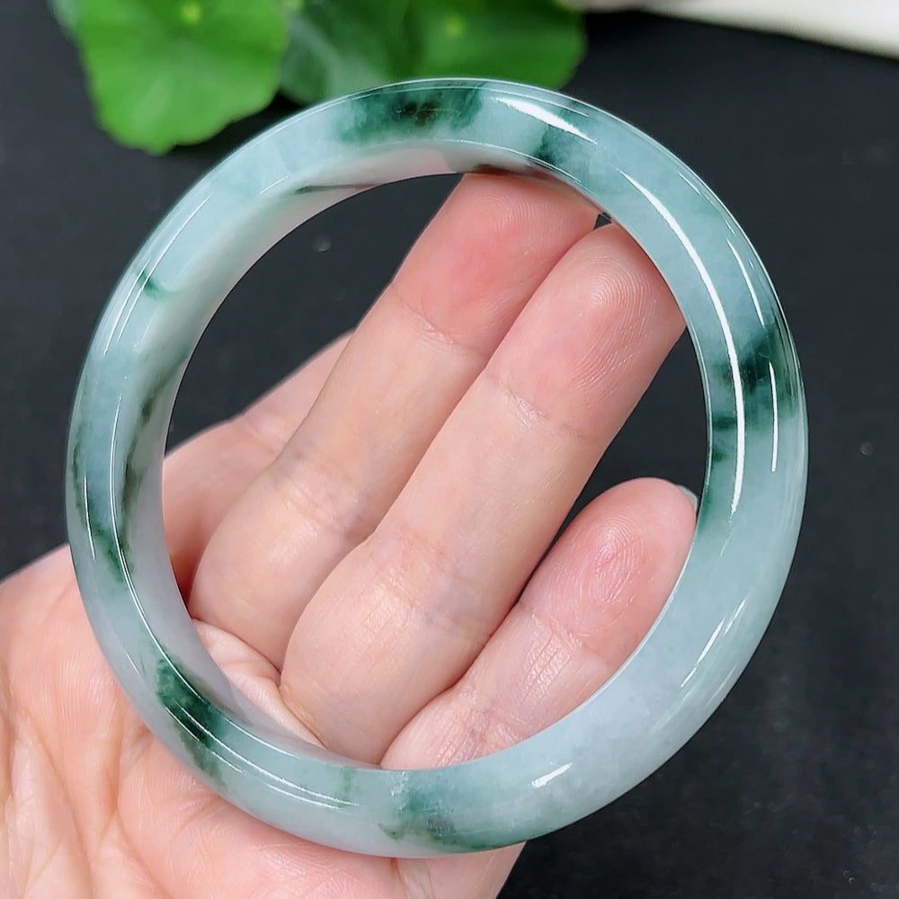 HKHQ jadeite round bangle in size 59.5, weighing 47.4g, showcasing a smooth, polished green jadeite bracelet on a plain background.