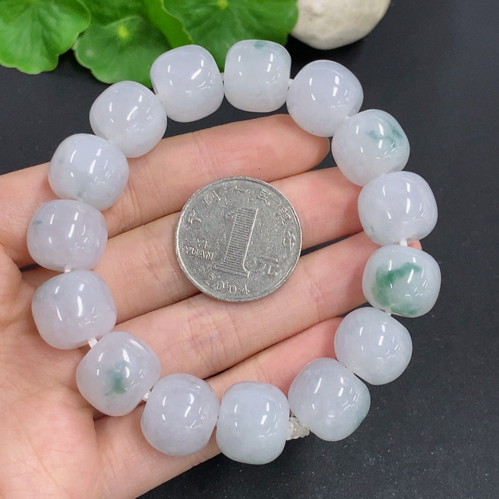 HKHQ jadeite bracelet weighing 83.3g featuring smooth, polished green jadeite beads displayed in a close-up shot.