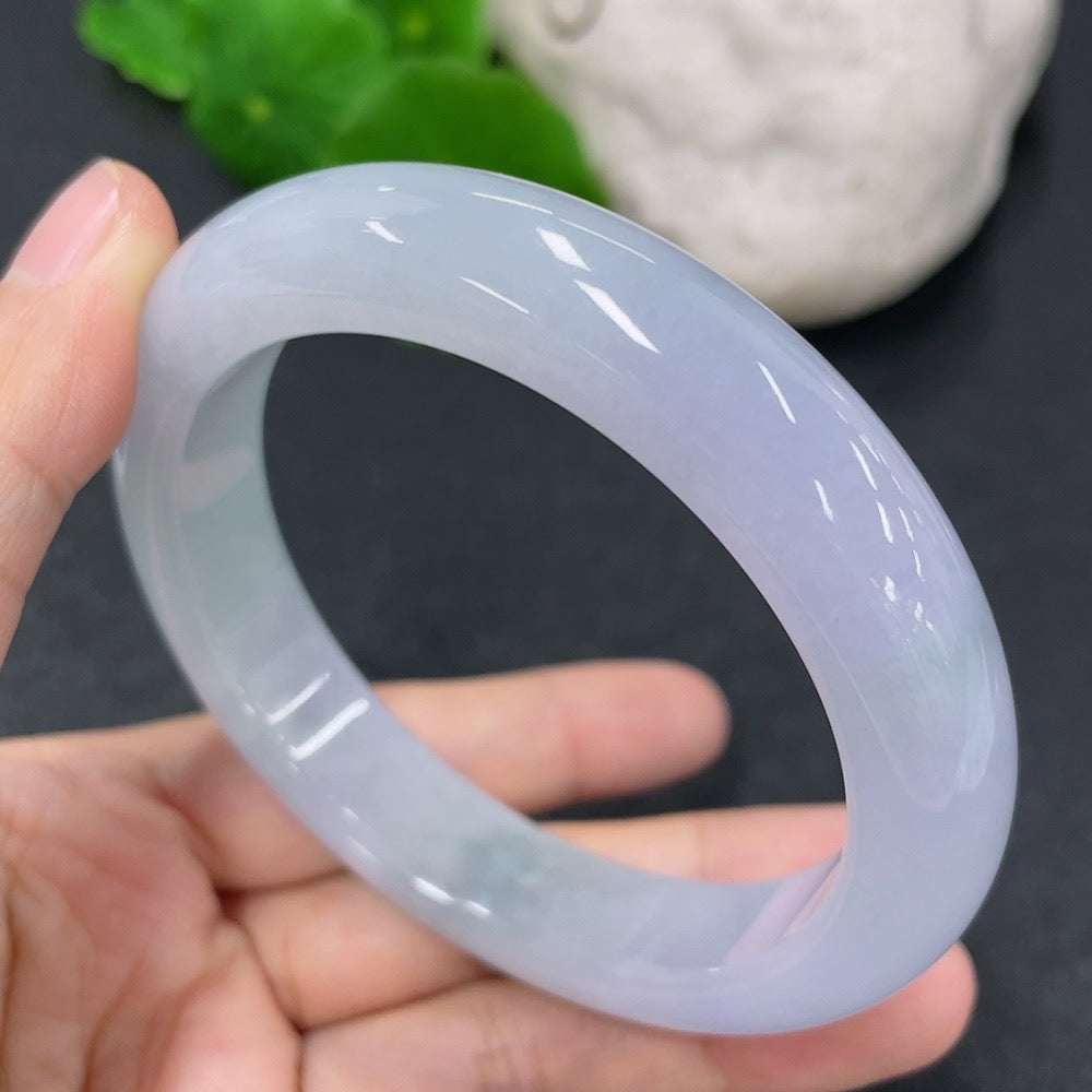 HKHQ jadeite round bangle in size 56.5 with a weight of 63.79g, showcasing smooth, polished green jadeite bracelet.