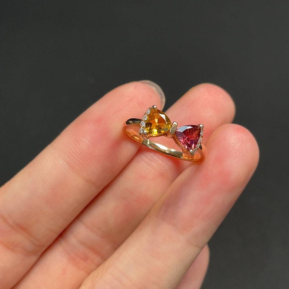 18k gold tourmaline ring with gemstones, size 12, weighing approximately 2.1 grams, showcasing vibrant colored stones.