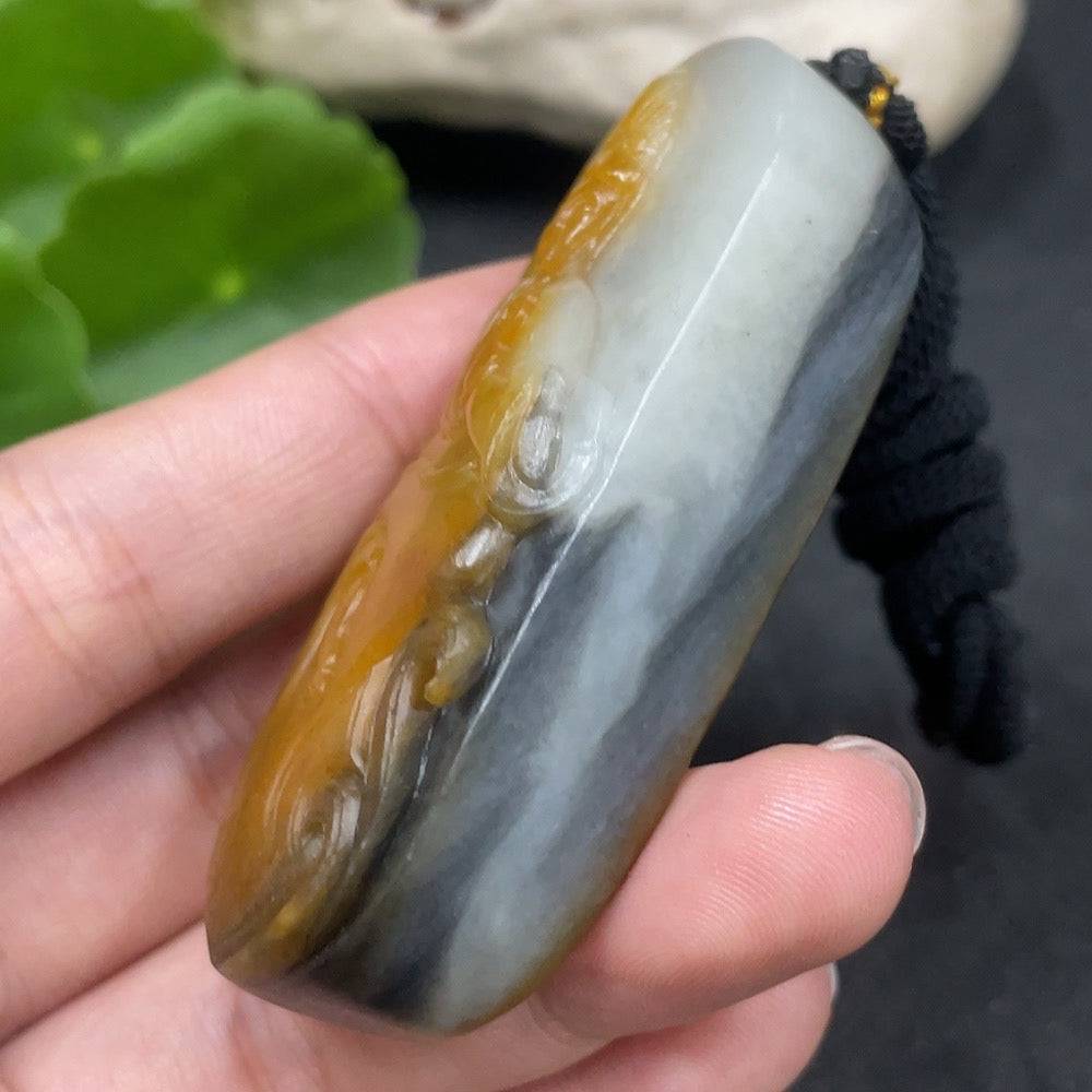 Huiliu Certified Hetian Jade Guanyin pendant with mineral inclusions and rope, featuring undetermined skin color formation.