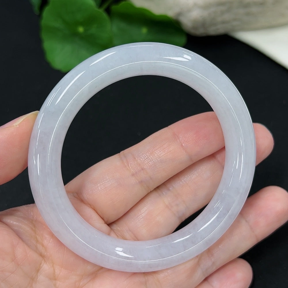 HKHQ jadeite round bangle, size 55, weighing approx. 53.33g, showcasing smooth, polished jade surface and vibrant green color.