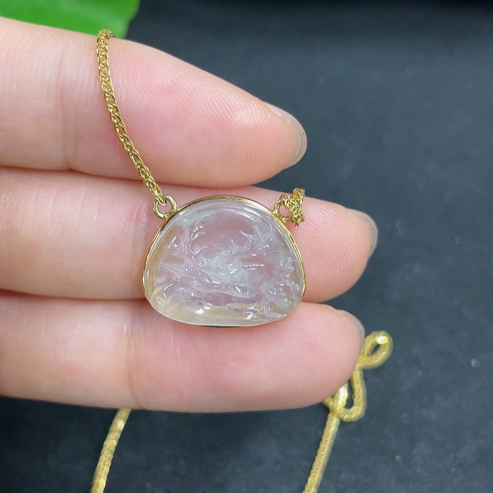 Jadeite pendant with 18K gold setting on a chain, elegant jewelry piece from HKHQ featuring smooth green jadeite gemstone.