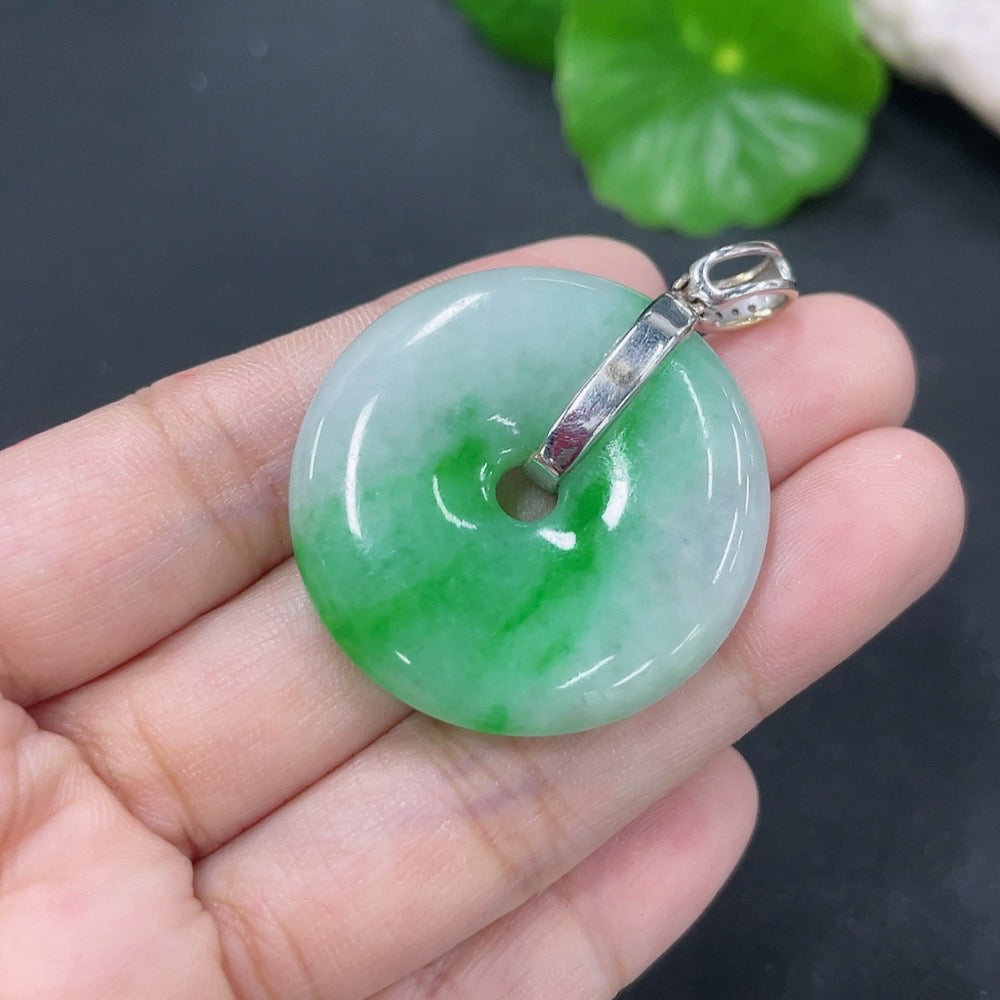 Jadeite pendant with peace knot design, 18k gold accents, diamond details, crafted by HKHQ, weighs approximately 16.12g