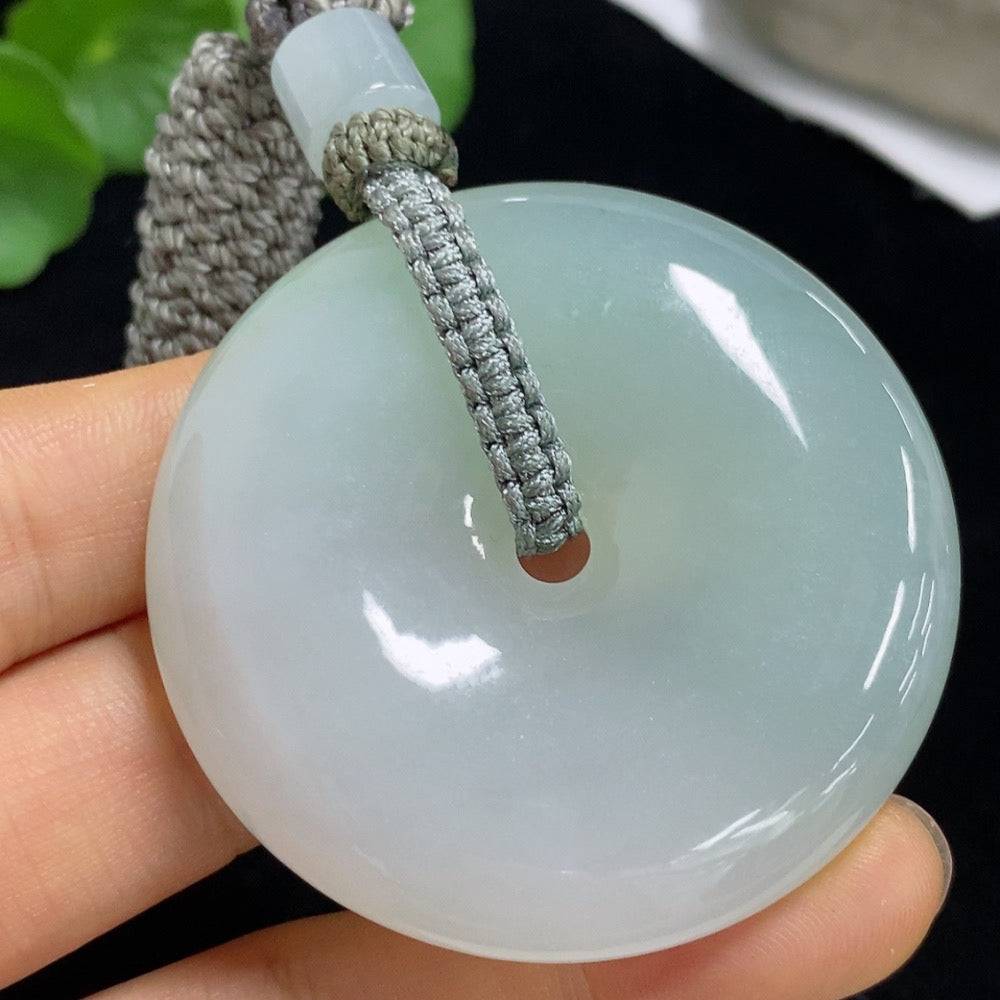 Huiliu Jadeite Peace Knot Pendant with rope weight, crafted from smooth jade, featuring intricate knot design for elegant jewelry.