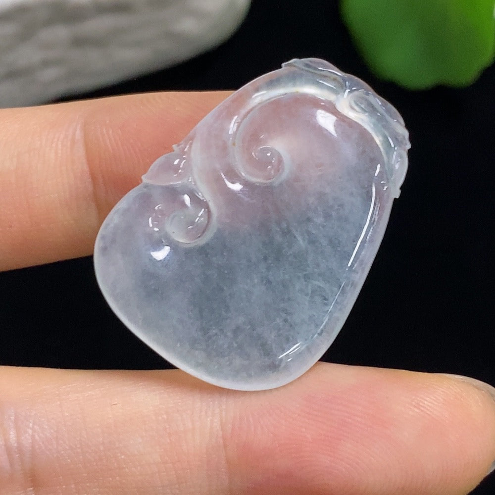 Jadeite Ruyi carving jewelry with inlaid setting, featuring intricate design and vibrant green jadeite, by HKHQ.