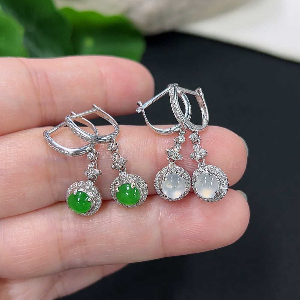 Jadeite inlaid earrings with 18K gold and diamond accents, featuring intricate design and elegant craftsmanship.