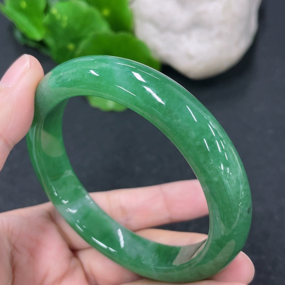 HKHQ jadeite round bangle, size 53.8mm, weighing approximately 49.13g, showcasing smooth, polished jadeite surface.
