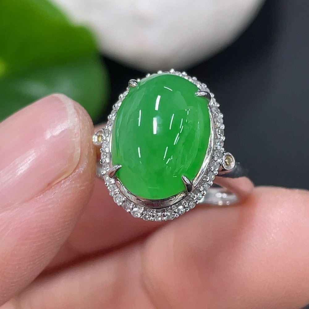 Jadeite cabochon ring in 18K gold with diamond accents, size 9, featuring a polished jade gemstone and elegant gold band.