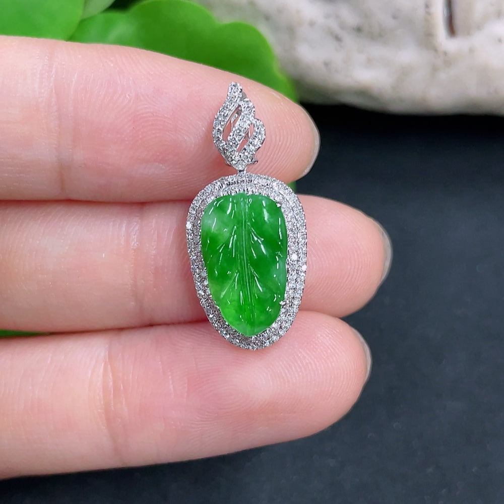 Jadeite leaf pendant with 18k gold and diamond accents, lightweight jewelry piece showcasing intricate design and craftsmanship.