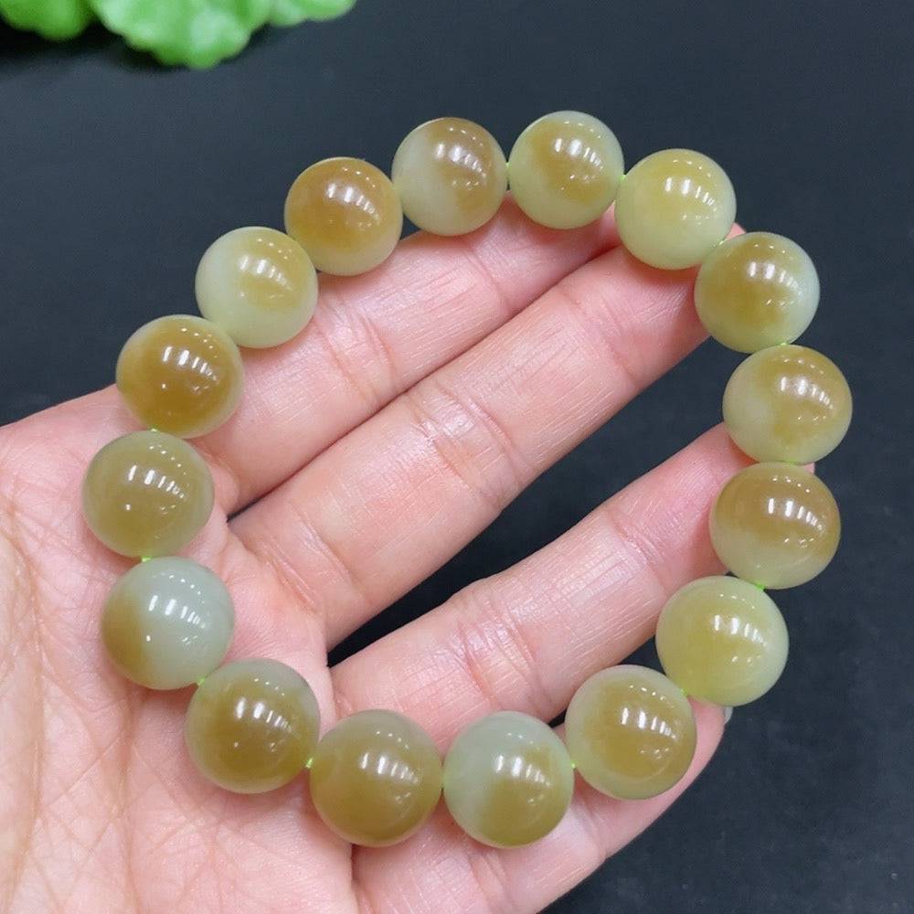 Hetian jade bracelet with 11.9mm beads, weighing approximately 41.7g, featuring smooth, polished green jade stones.