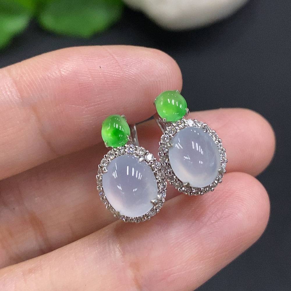Jadeite cabochon earrings with 18k gold and diamond accents, featuring polished jade stones and intricate gold settings.