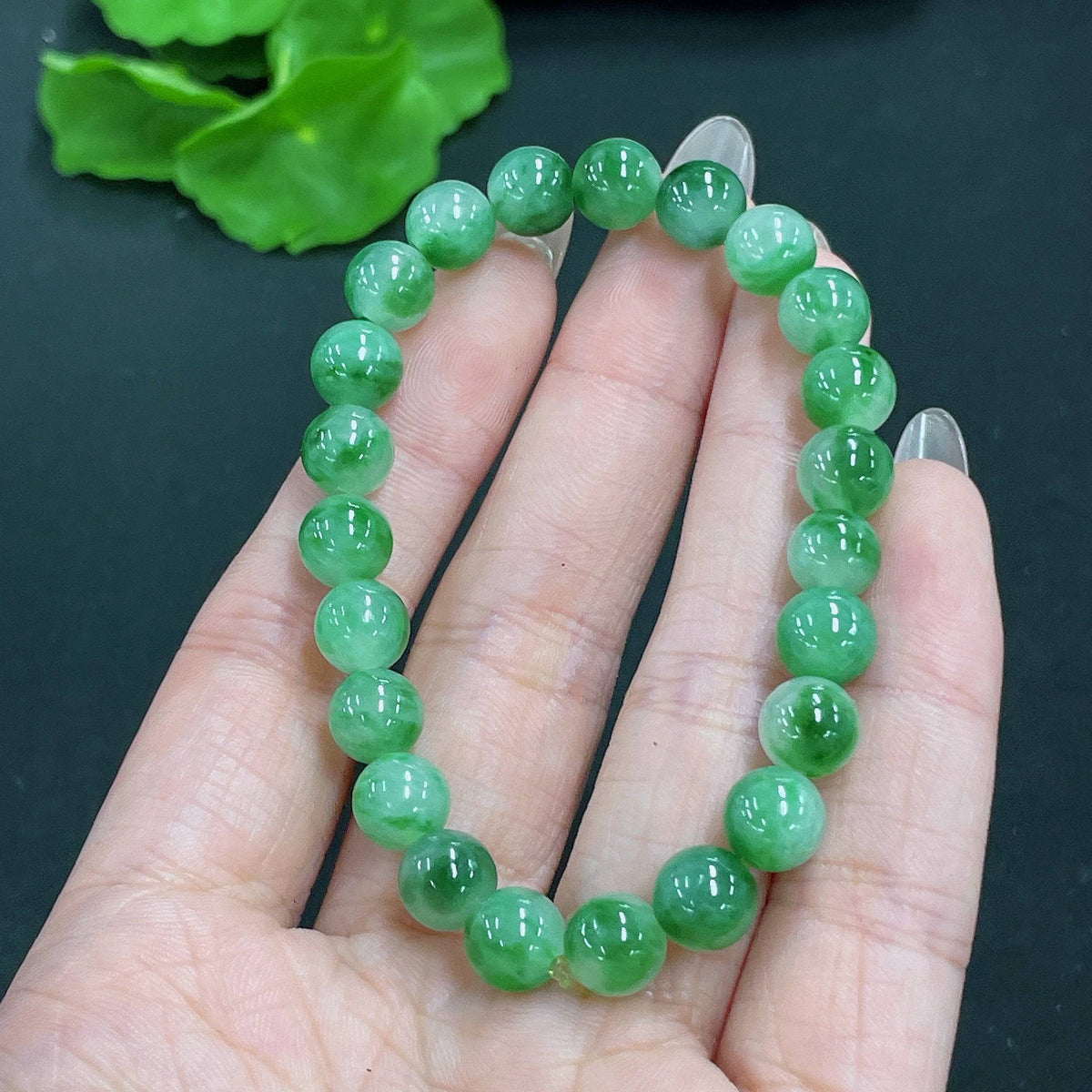 HUILIU HQ jadeite bracelet with 7.8mm beads, weighing 19.23g, featuring natural mineral components, showcasing smooth green jade stones.