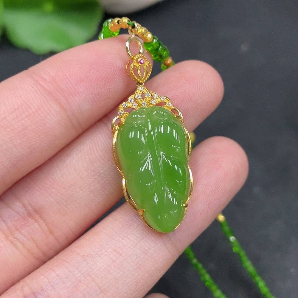 Hetian jade jasper leaf pendant with non-Hetian jade beads, 18k gold chain, showcasing detailed craftsmanship and natural stone textures.