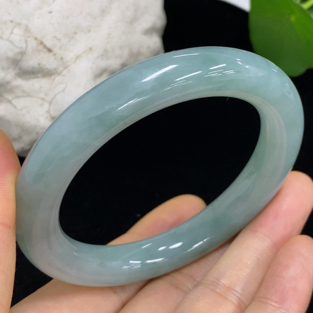 HKHQ jadeite round bangle in size 53.8 with a smooth, polished surface and a weight of 57.98g, showcasing vibrant green color.