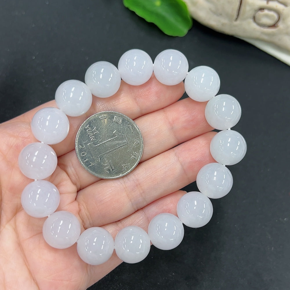HKHQ jadeite bracelet with 12.8mm beads, showcasing smooth, polished green jadeite stones and a substantial 58.1g weight.