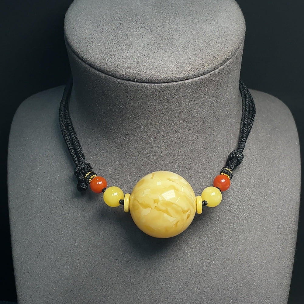 Amber Beeswax Pendant, . (including rope), Size . 33mm, with Southern Red Agate | Huiliu Certified
