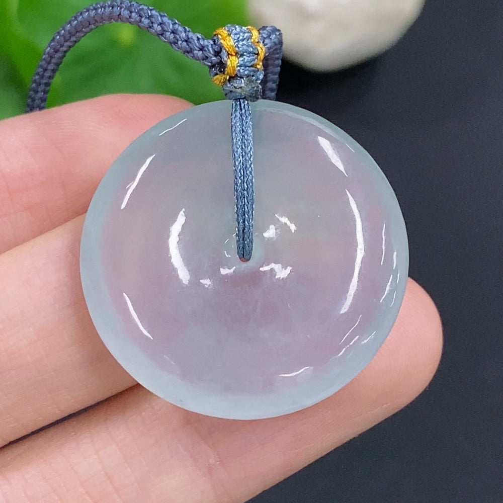 Jadeite safety pendant necklace by HKHQ featuring a smooth green jadeite stone on a delicate chain.