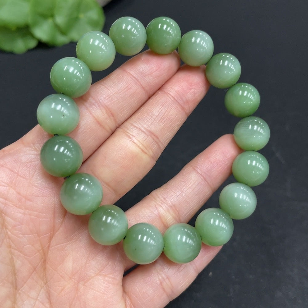 Hetian Jade Jasper bracelet with 11.7mm beads, featuring natural jade stones, weighing approximately 44.6 grams, by HUILIU HQ.