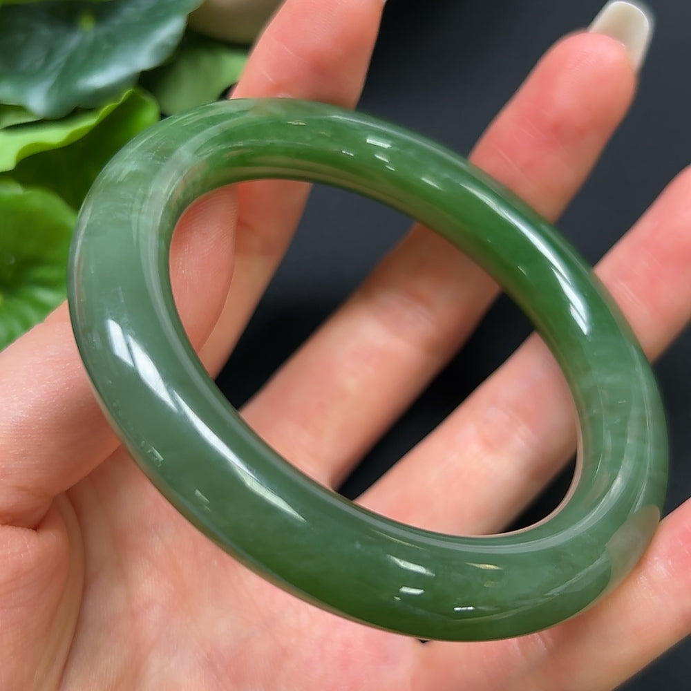 HKHQ Hetian Jade round bangle bracelet, size 55.4, weighing 56.99g, featuring smooth, polished jade surface.
