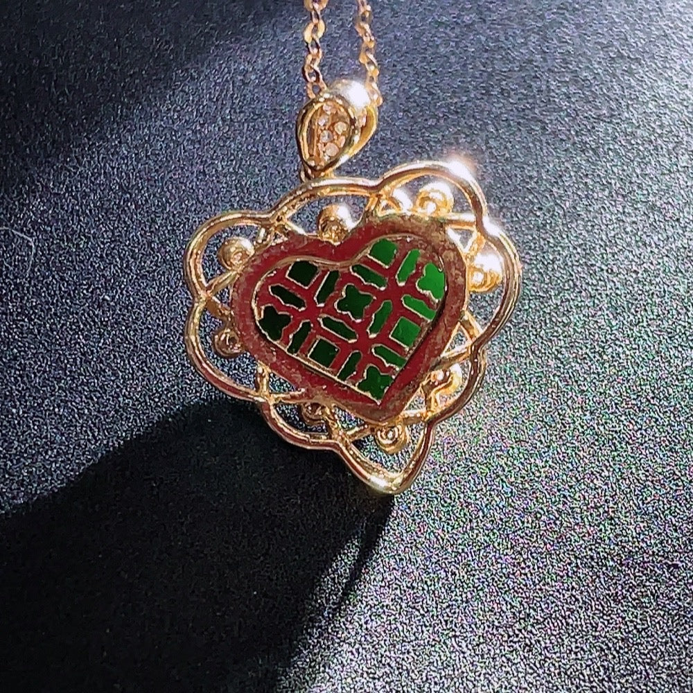 Jadeite heart-shaped pendant with 18k gold and diamond accents