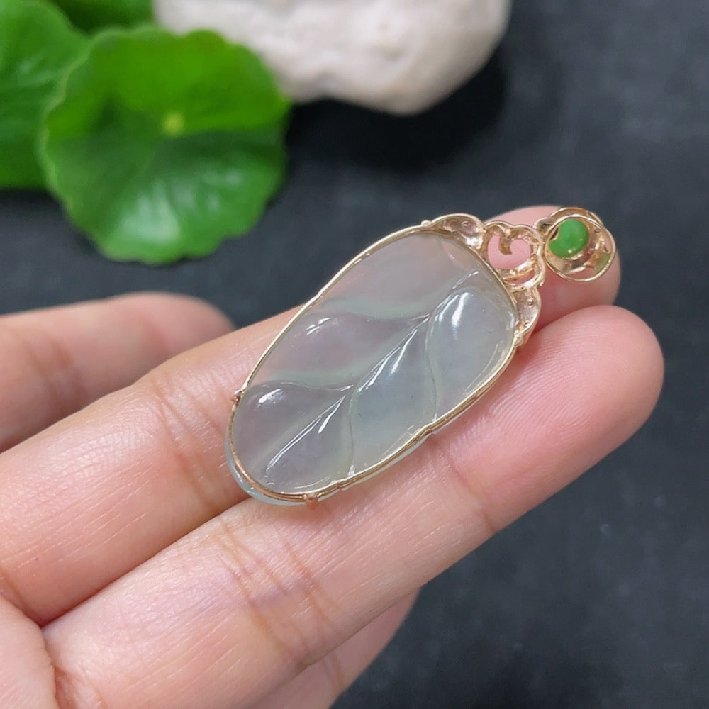 Huiliu Jadeite leaf pendant with diamond accents, crafted from green jade, featuring intricate leaf design and sparkling diamond details.