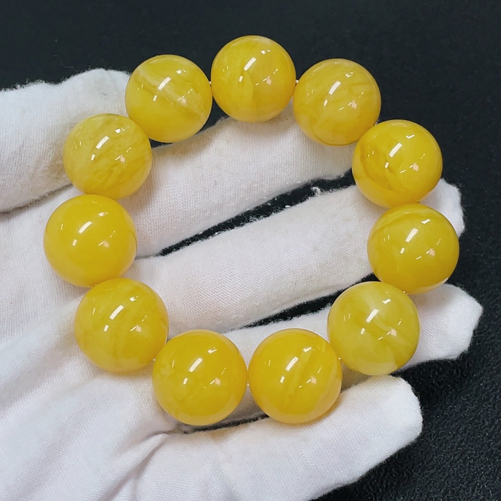 Amber beeswax bead bracelet with gemstone accents, approx. 18.3mm beads and partial repairs, by HKHQ.