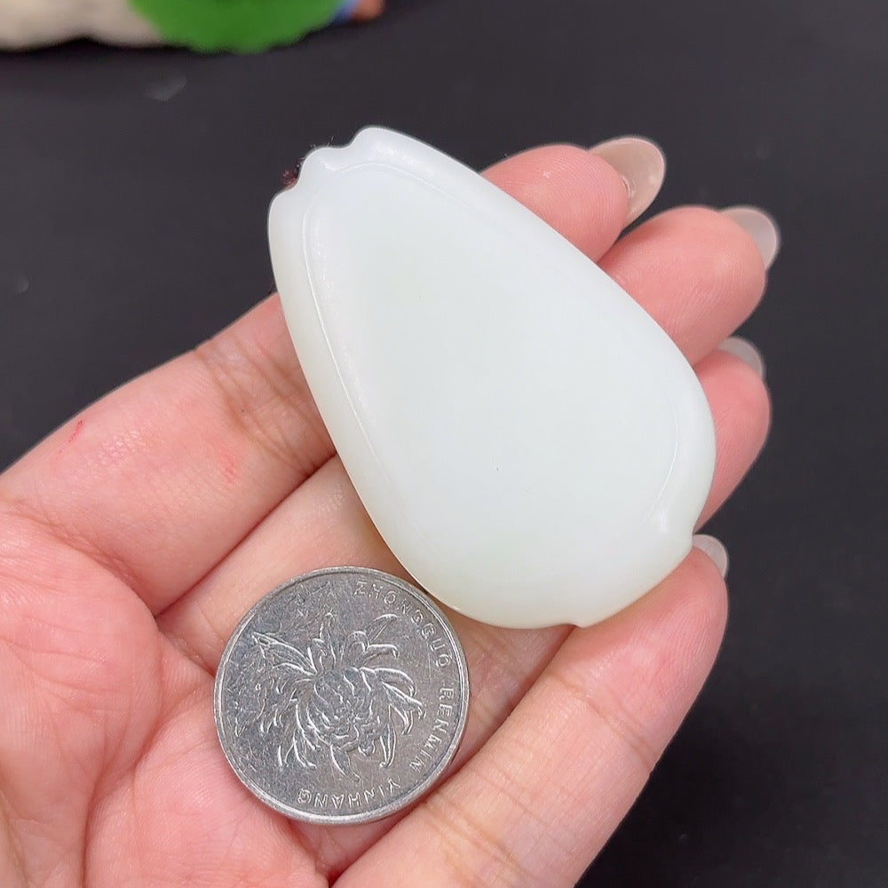 HKHQ Hetian Jade pendant with plain design, weighing approximately 48.1g, shown with cord on a neutral background.