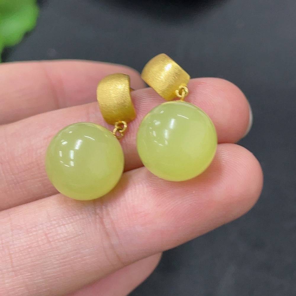 Hetian Jade inlaid earrings with 18K gold setting, approximately 11.8mm in size, from HUILIU HQ.