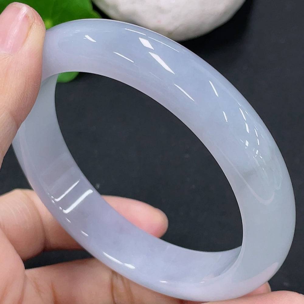 Huiliu Certified Jadeite round bangle showcasing smooth, polished jade with a vibrant green hue on a plain background.