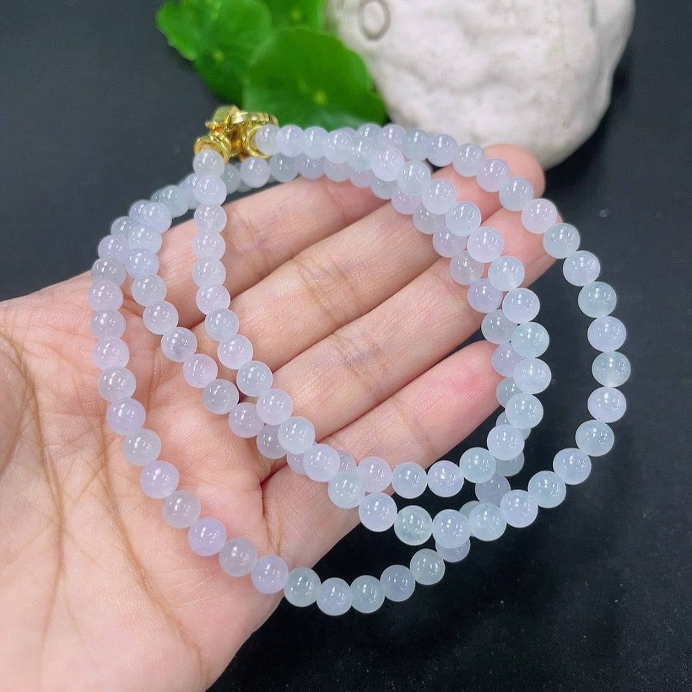 HKHQ jadeite bead necklace with 5.2mm beads, approximately 32.1g, showcasing smooth, round jade beads on a neutral background.