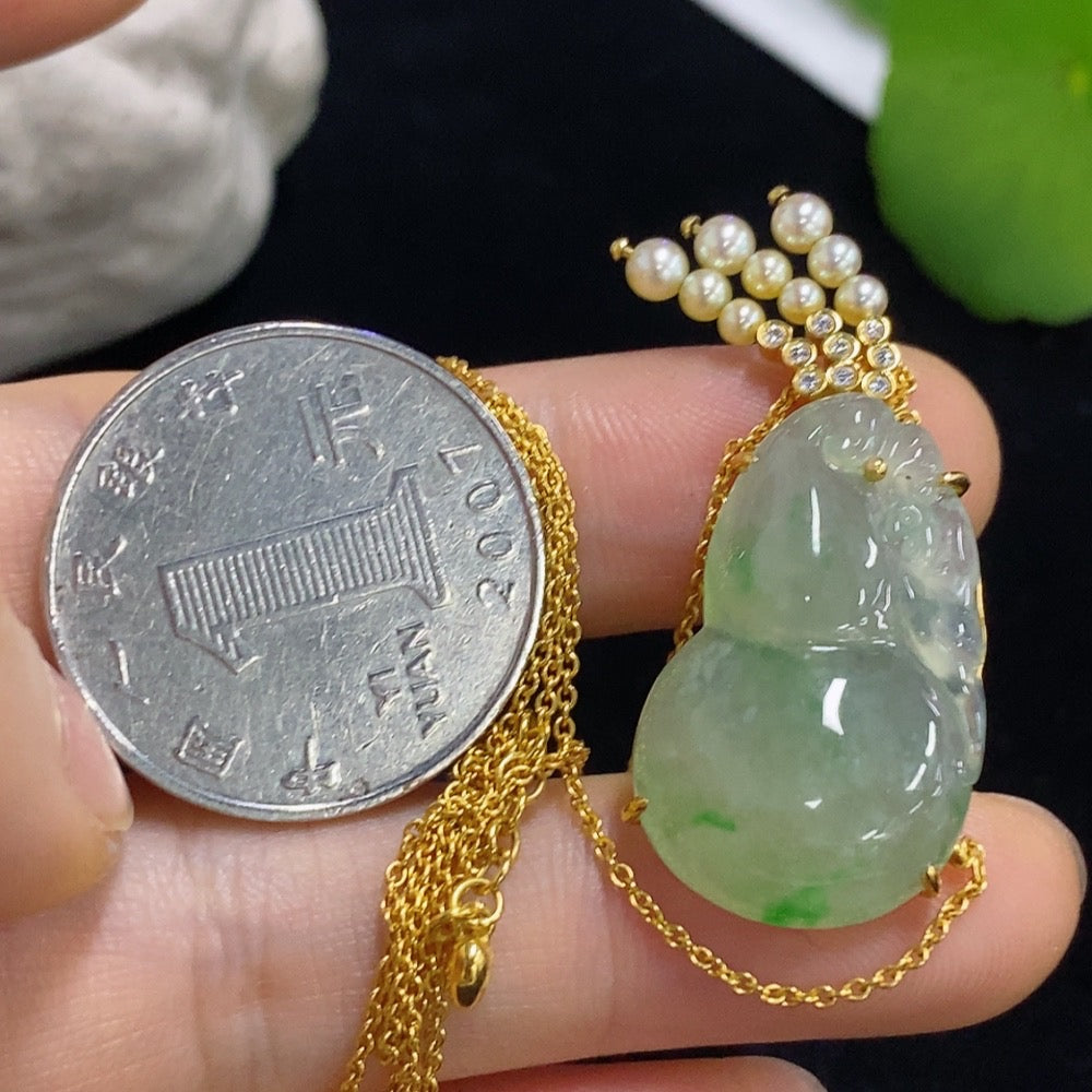 Jadeite gourd pendant set in 18k gold with diamond accents, total weight approximately 8.15g (including chain)