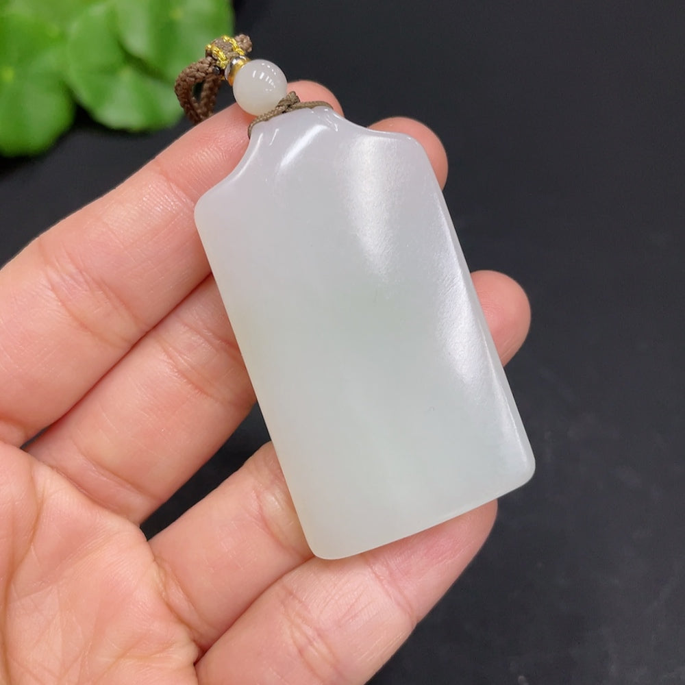 Huiliu certified Hetian jade pendant featuring a plain, smooth jade surface with a polished finish and traditional design.