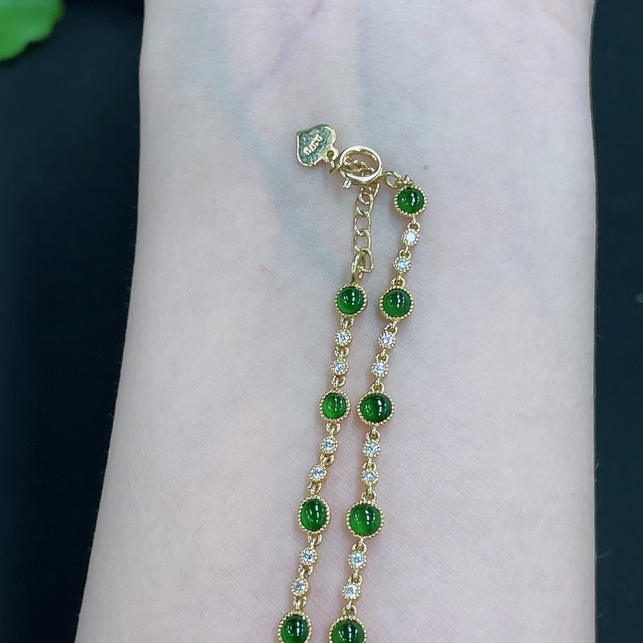 Jadeite cabochon inlaid bracelet by HUILIU HQ featuring 18k gold and diamond accents, with a total weight of approximately 4.09 grams.