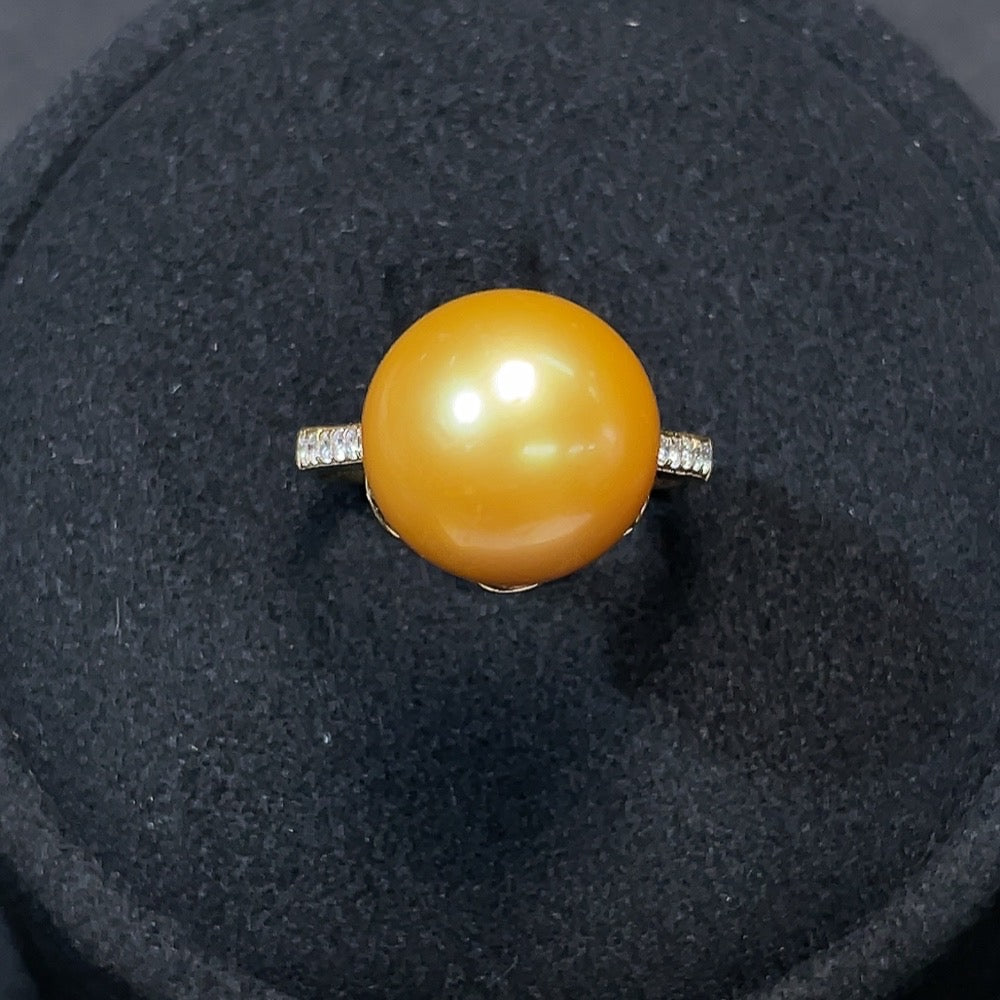 Saltwater Pearl and Diamond Ring in 18K gold featuring a lustrous pearl and sparkling diamonds, designed by HKHQ.