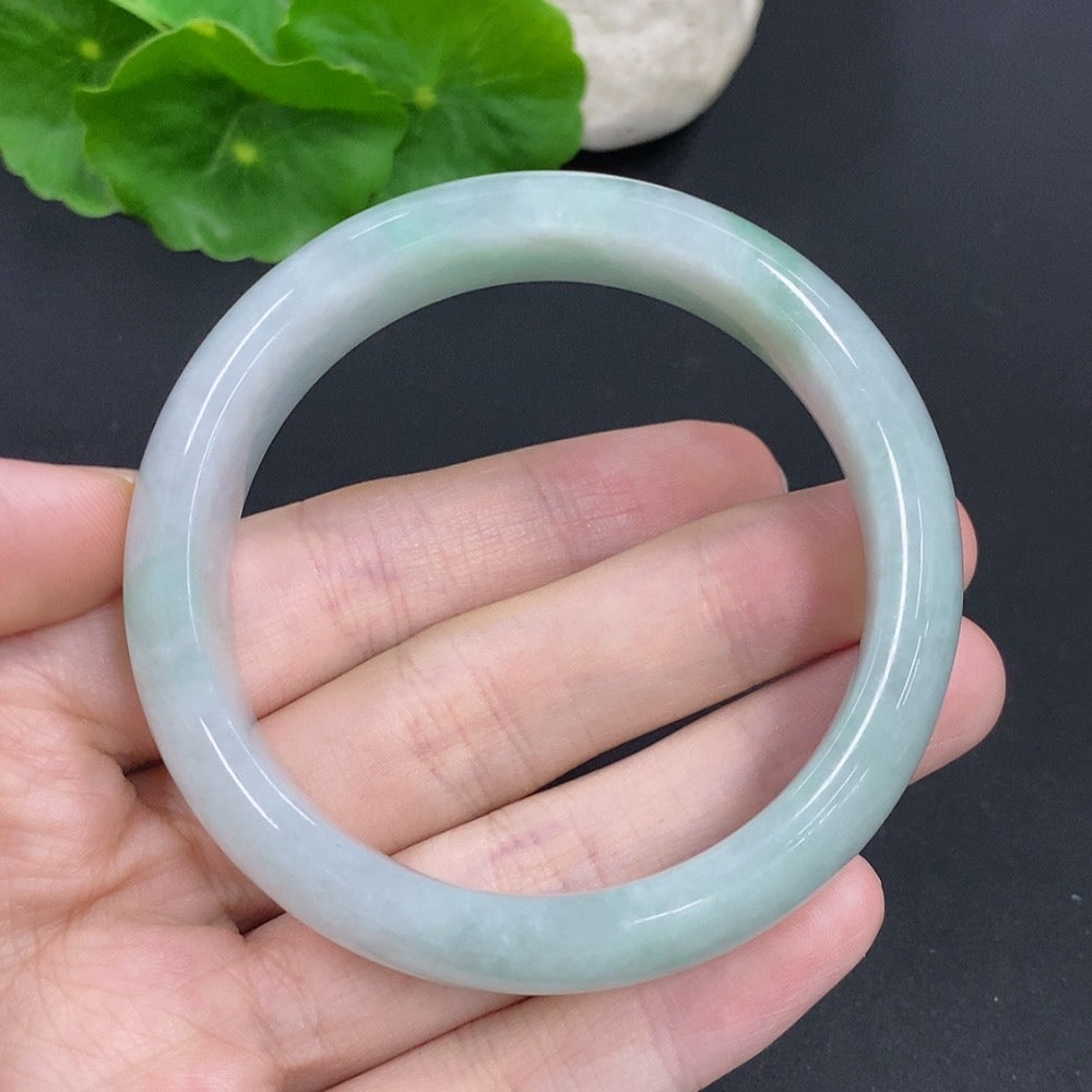 HKHQ jadeite round bangle, 54.5mm size, approximately 64.6g, showcasing smooth, polished green jade jewelry.