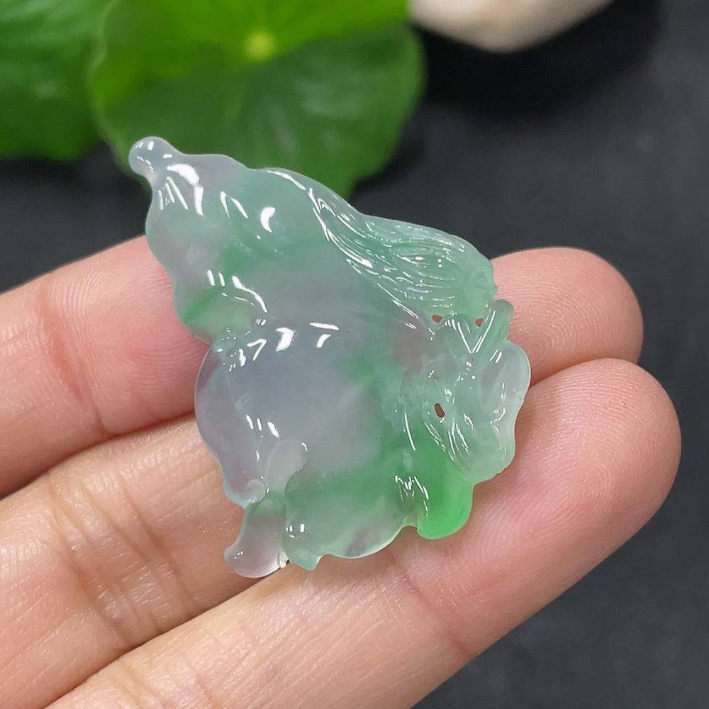 Jadeite pendant shaped like a butterfly fairy, crafted from green jade with intricate details, by HUILIU HQ.