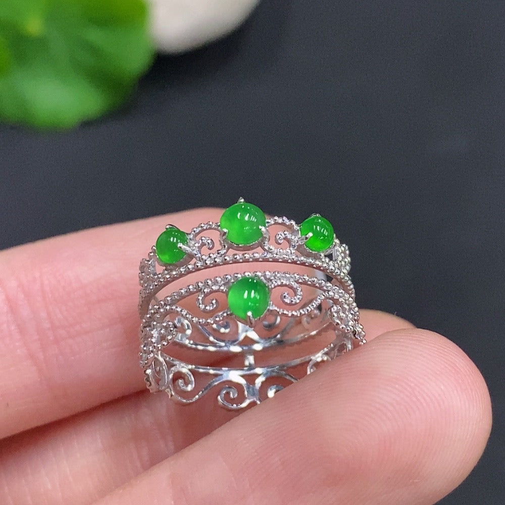 Jadeite cabochon solitaire ring with 18K gold band, size 9, featuring a smooth, polished green jade stone on a gold setting.
