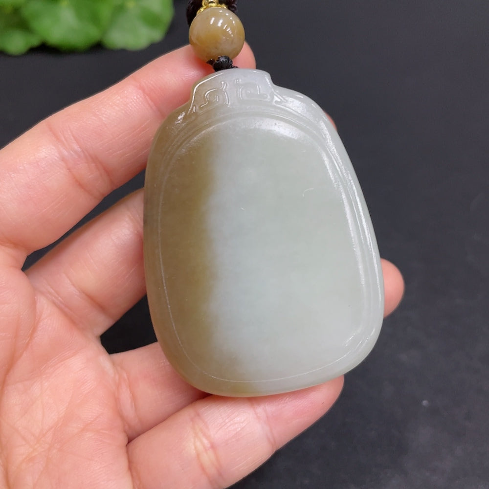 Huiliu HUILIU HQ plain Hetian Jade pendant featuring smooth, polished green jade stone on a simple string.