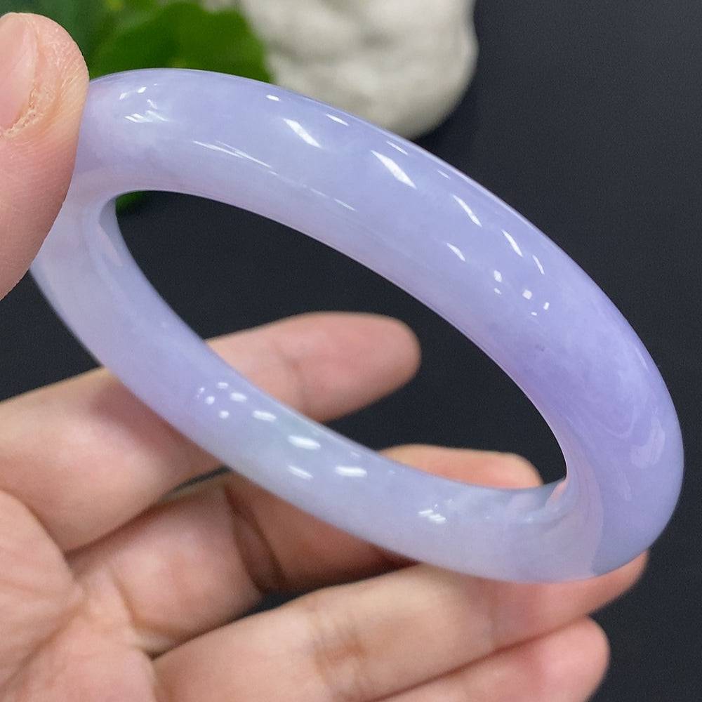 Jadeite round bangle with size 56.6, weighing approximately 66.9g, crafted by HUILIU HQ, showcasing smooth, polished jade surface.