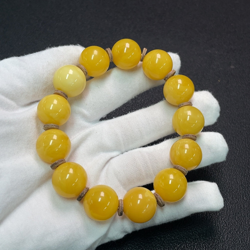 Huiliu Amber Beeswax Bracelet with 16.1mm amber beads, natural beeswax appearance, stylish jewelry accessory.