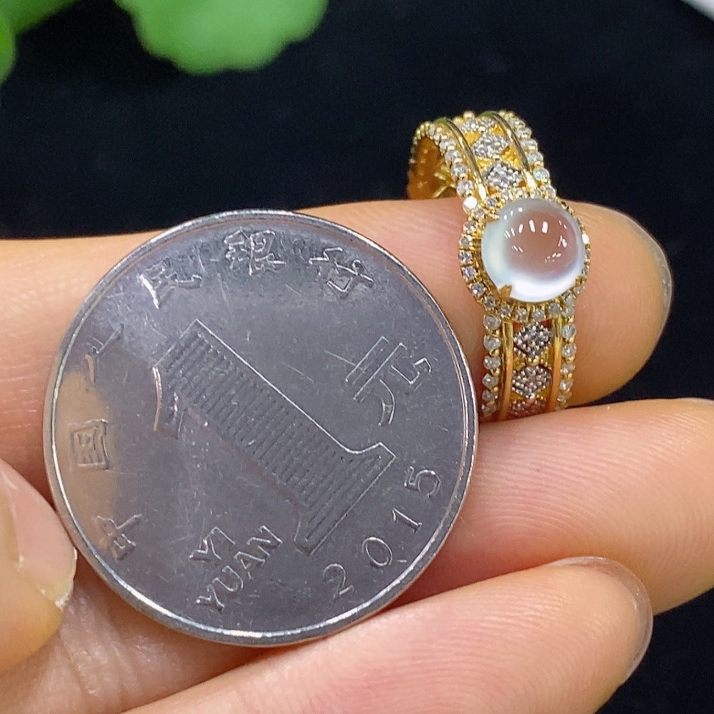 HUILIU HQ Jadeite cabochon ring with diamond accents, featuring polished green jade and sparkling diamond details.