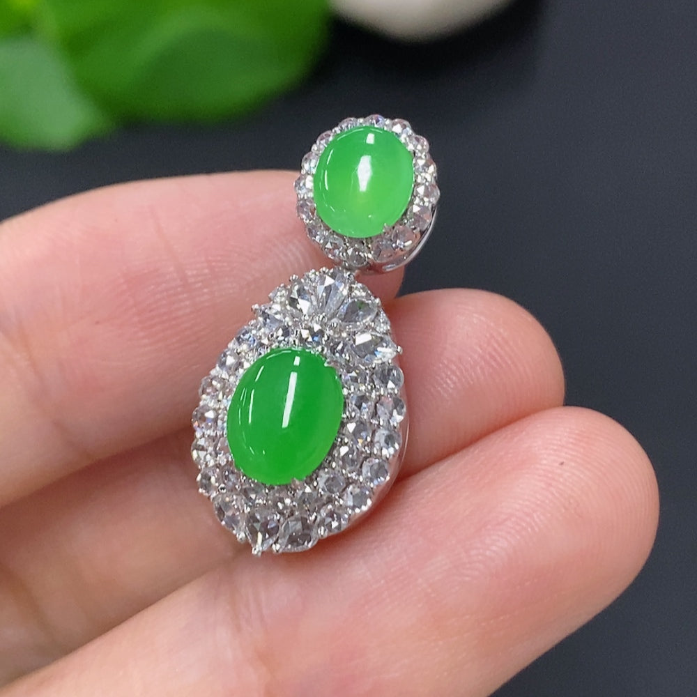 Jadeite cabochon pendant with diamond accents set in 18K gold, crafted by HKHQ, weighing approximately 4.4 grams.