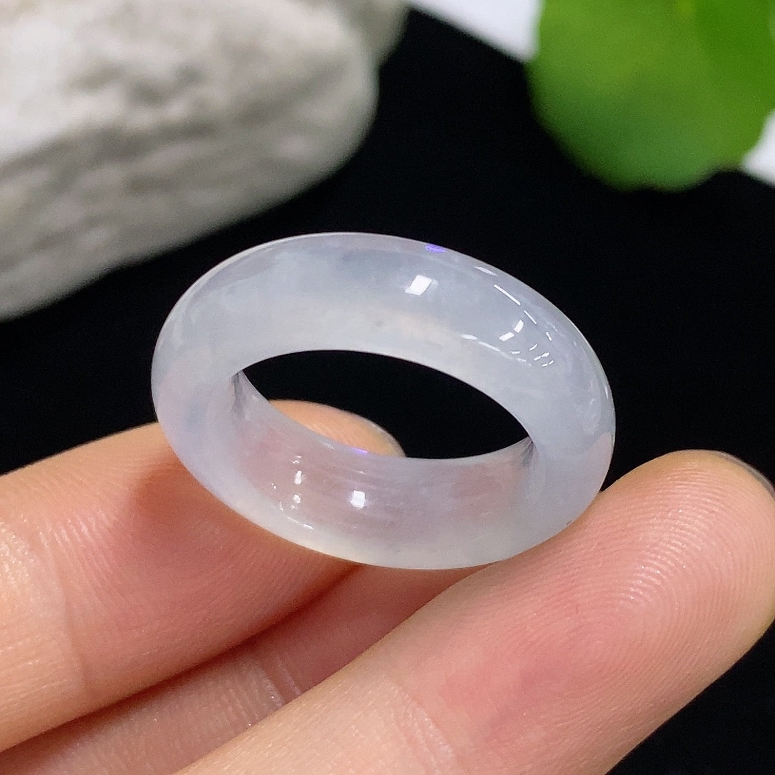 Close-up of a green jadeite ring from HKHQ featuring a polished jade gemstone set in a simple band.