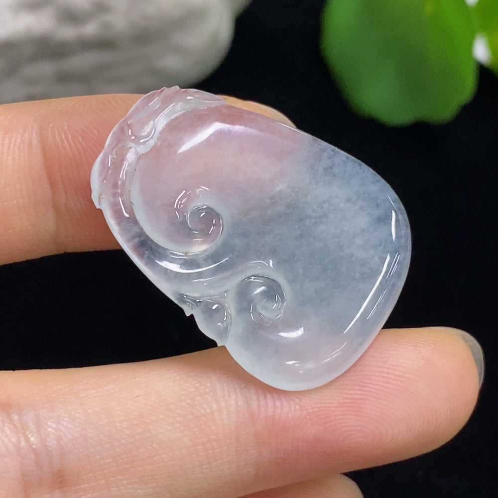 Jadeite Ruyi carving jewelry by HKHQ featuring intricate design and inlaid setting, displayed on a neutral background.