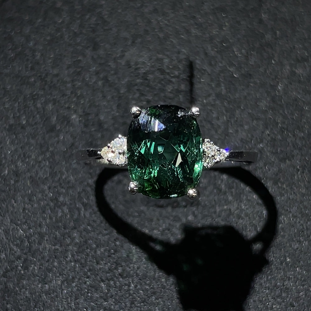 HKHQ tourmaline ring with gold setting and diamond accents, showcasing vibrant gemstone and elegant gold band design