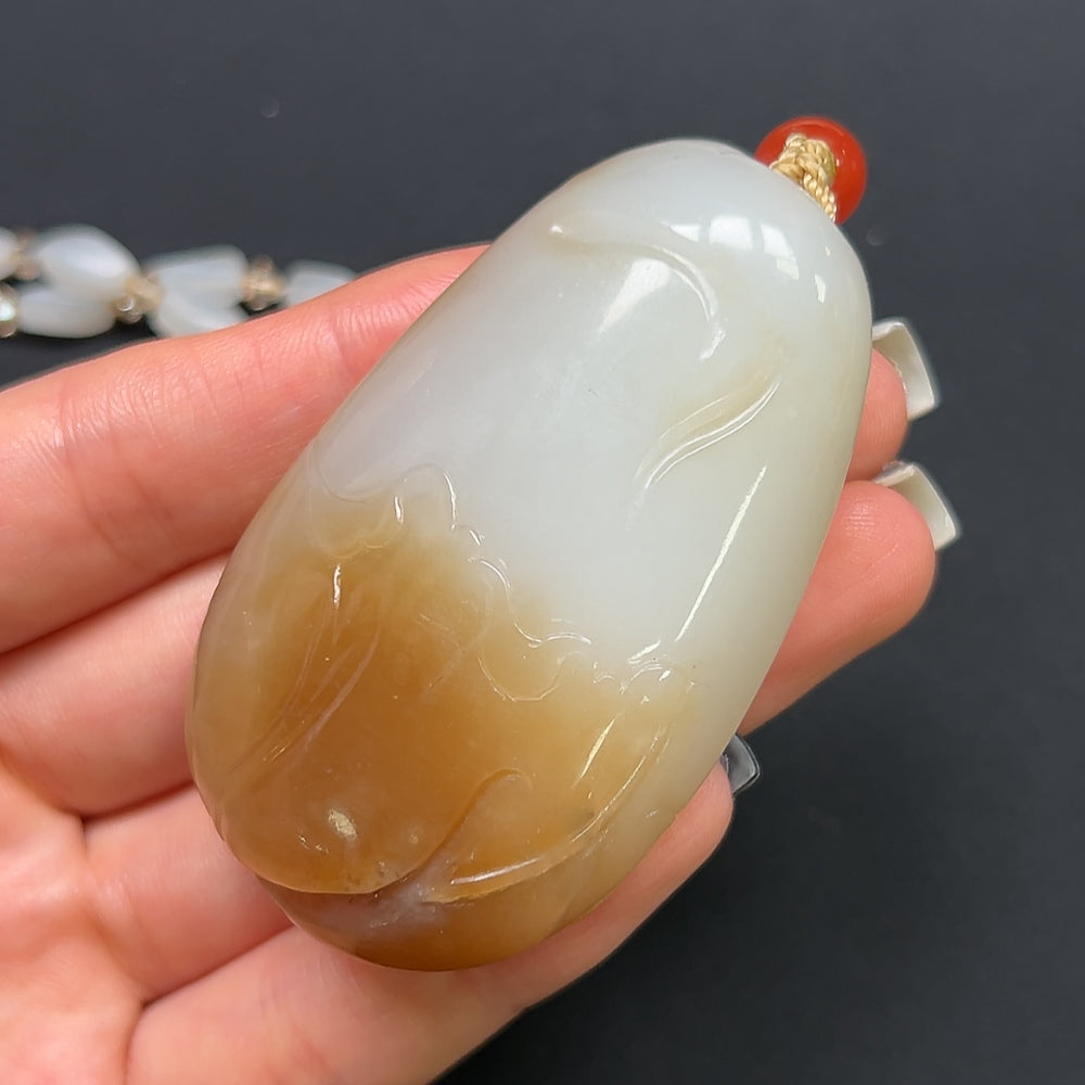 Hetian Jade "Joy on the Brow" pendant necklace with non-Hetian beads, featuring intricate jade craftsmanship and elegant design.