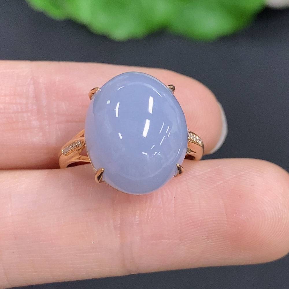 Huiliu Jadeite cabochon ring with diamond accents, featuring a polished green jade gemstone in a silver setting.