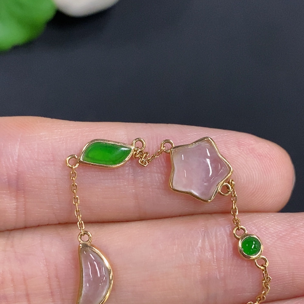 Jadeite inlaid bracelet with 18k gold, featuring green non-A grade jade stones, shown on a delicate wrist.